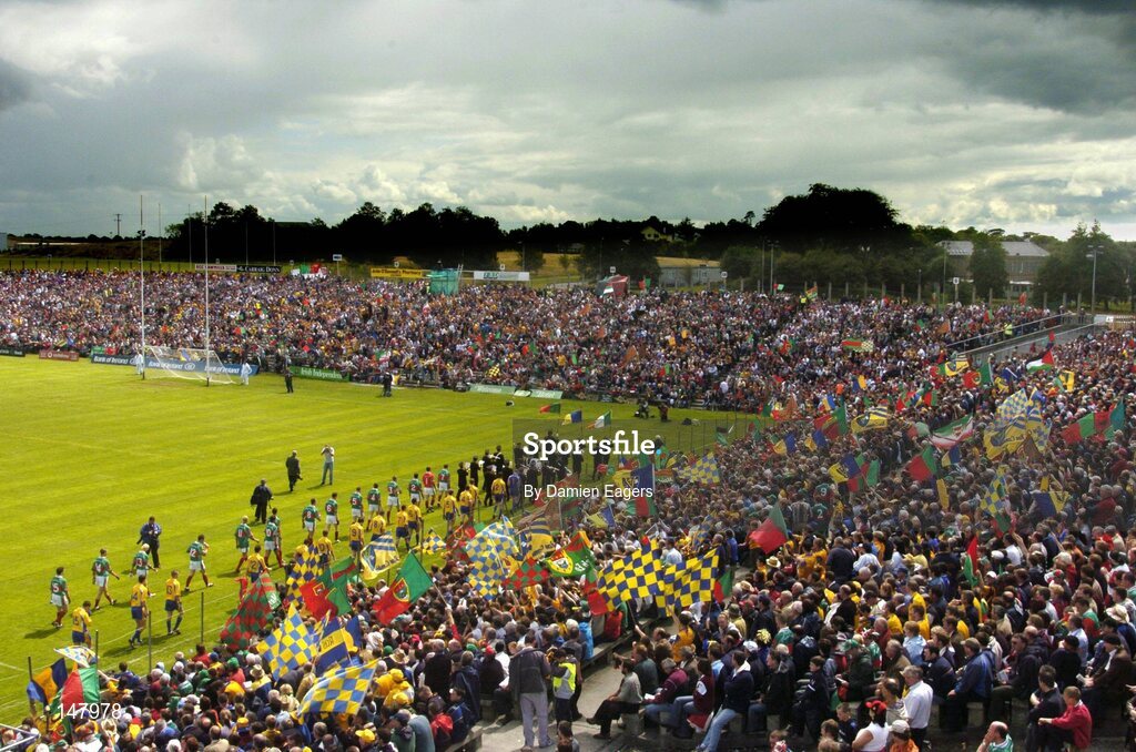 18 July 2004; The Mayo and Roscommon teams walk in front of their supporters during the pre-match parade in McHale Park. Bank of Ireland Connacht Senior Football Championship Final, Mayo v Roscommon, McHale Park, Castlebar, Co. Mayo. Picture credit; Damien Eagers / SPORTSFILE