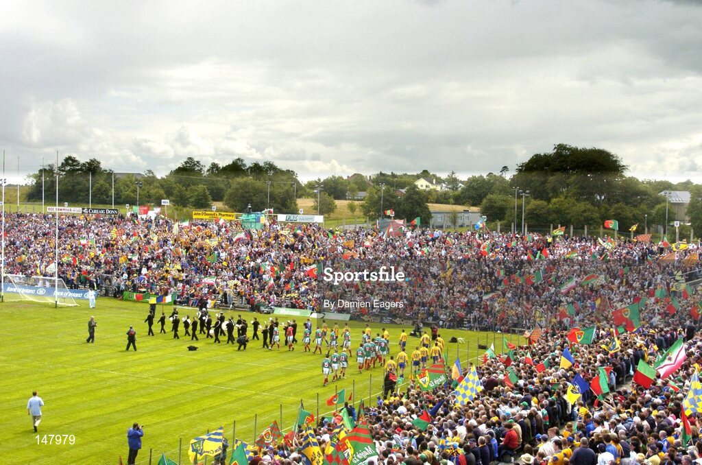 18 July 2004; The Mayo and Roscommon teams walk in front of their supporters during the pre-match parade in McHale Park. Bank of Ireland Connacht Senior Football Championship Final, Mayo v Roscommon, McHale Park, Castlebar, Co. Mayo. Picture credit; Damien Eagers / SPORTSFILE