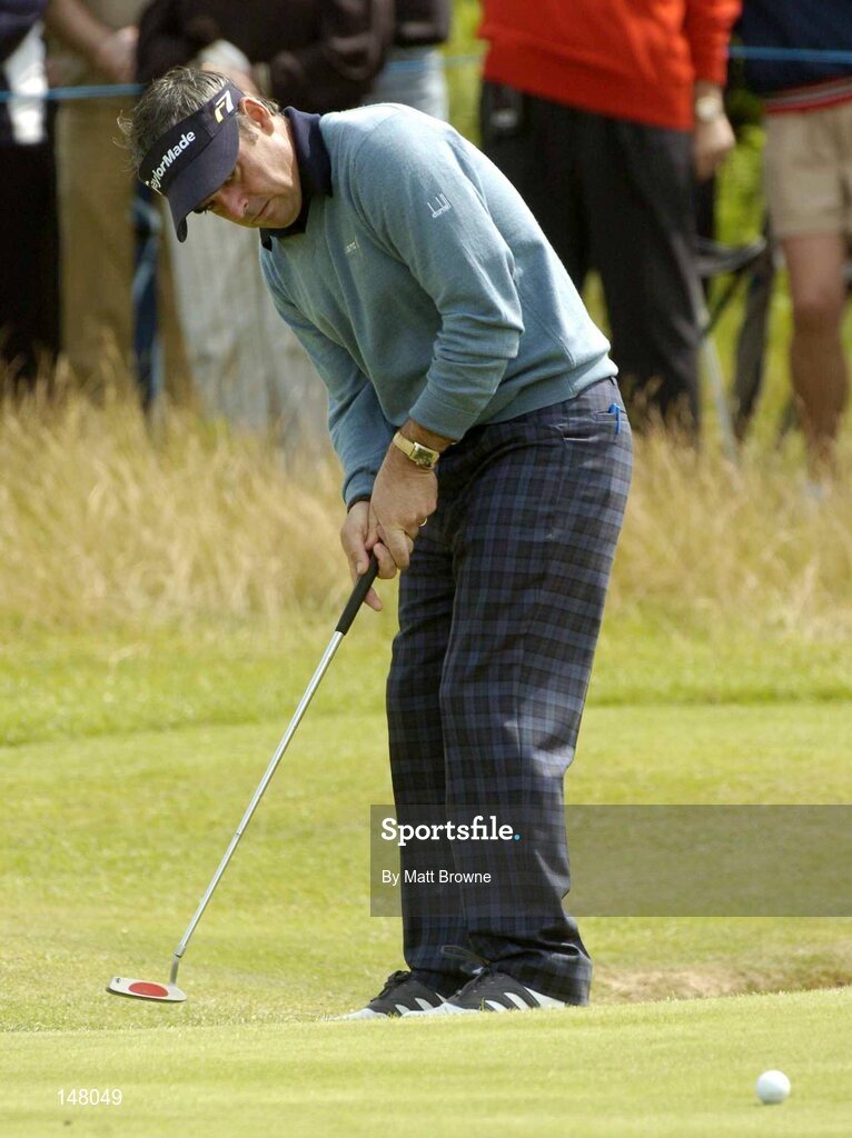 23 July 2004; Paul McGinley watches his putt on the 18th green during the second round. Nissan Irish Open Golf Championship, County Louth Golf Club, Baltray, Co. Louth. Picture credit; Matt Browne / SPORTSFILE