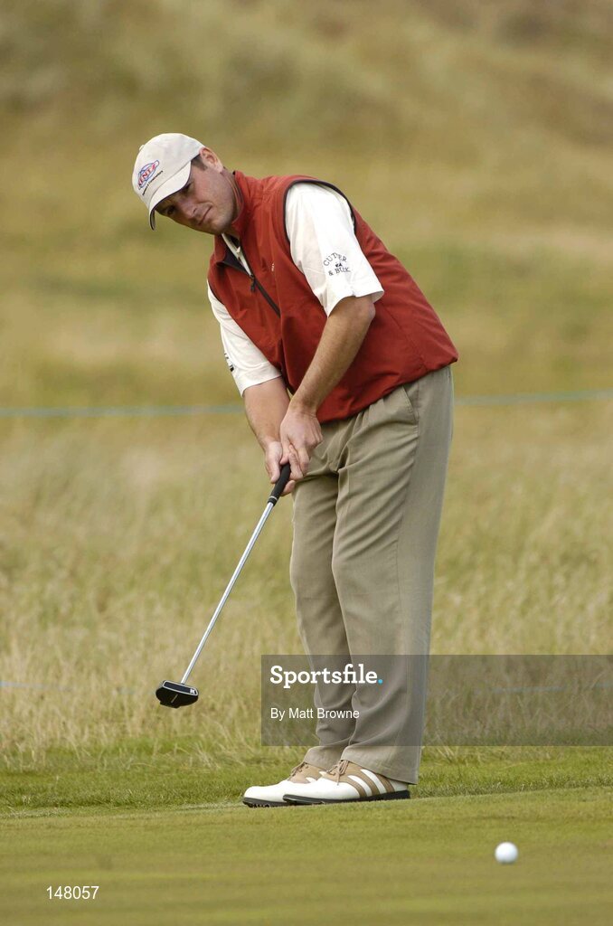 23 July 2004; David Higgins watches his putt on the 8th green during the second round. Nissan Irish Open Golf Championship, County Louth Golf Club, Baltray, Co. Louth. Picture credit; Matt Browne / SPORTSFILE