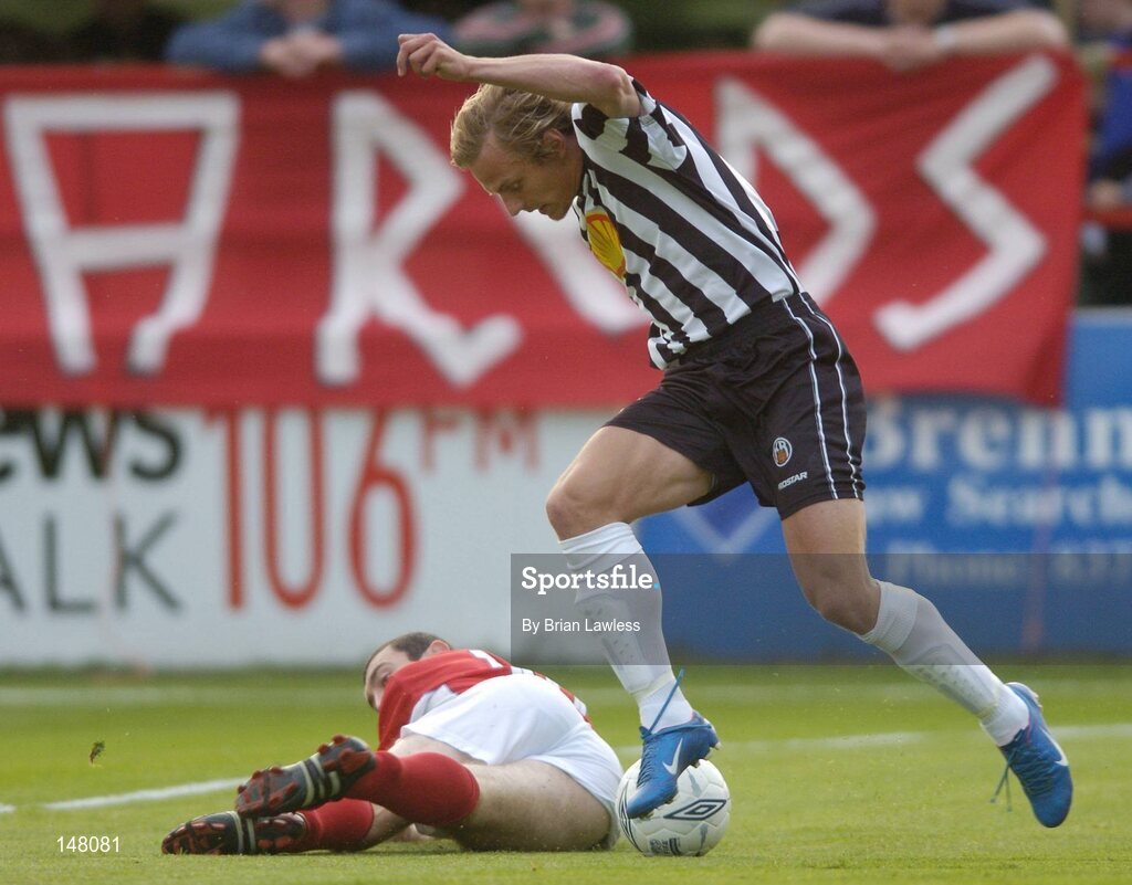 21 July 2004; Kristian Orn Sigurdsson, KR Reykjavik, in action against Jason Byrne, Shelbourne. UEFA Champions League 1st Qualifying Round, Second Leg, Shelbourne v KR Reykjavik, Tolka Park, Dublin. Picture credit; Brian Lawless / SPORTSFILE