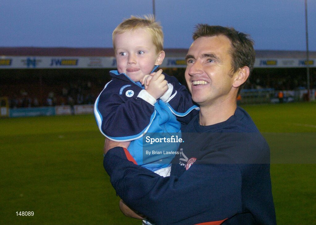 21 July 2004; Shelbourne manager Pat Fenlon with his son Pearse after victory over KR Reykjavik. UEFA Champions League 1st Qualifying Round, Second Leg, Shelbourne v KR Reykjavik, Tolka Park, Dublin. Picture credit; Brian Lawless / SPORTSFILE