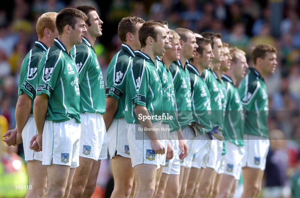 18 July 2004; The Limerick team stand together for the national anthem before the game. Bank of Ireland Munster Senior Football Championship Final Replay, Kerry v Limerick, Fitzgerald Stadium, Killarney, Co. Kerry. Picture credit; Brendan Moran / SPORTSFILE