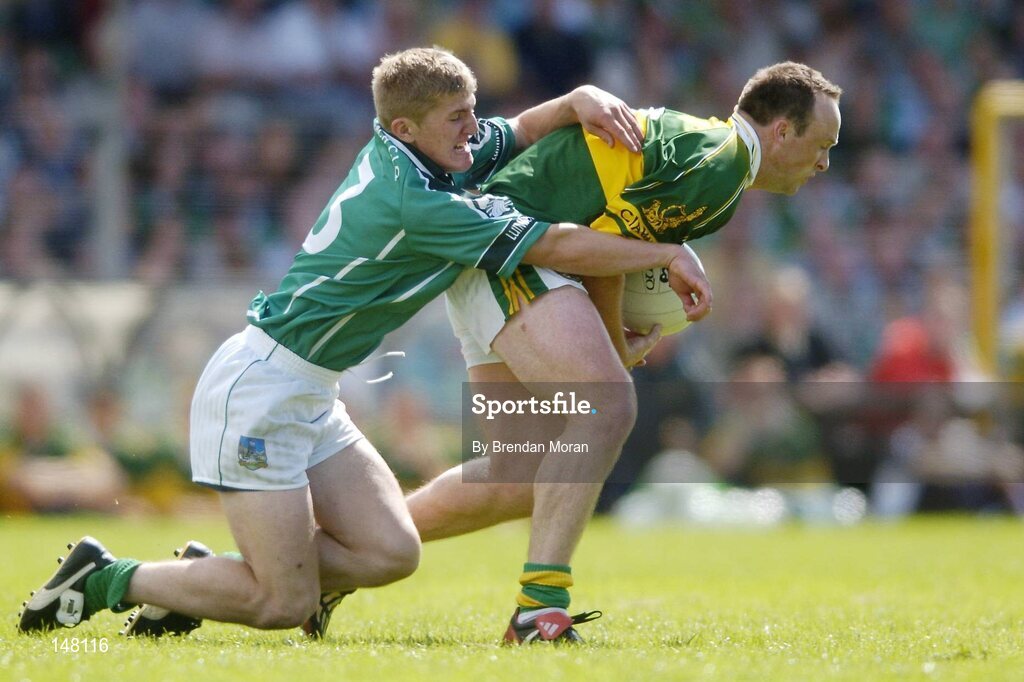 18 July 2004; John Crowley, Kerry, in action against Johnny McCarthy, Limerick. Bank of Ireland Munster Senior Football Championship Final Replay, Kerry v Limerick, Fitzgerald Stadium, Killarney, Co. Kerry. Picture credit; Brendan Moran / SPORTSFILE