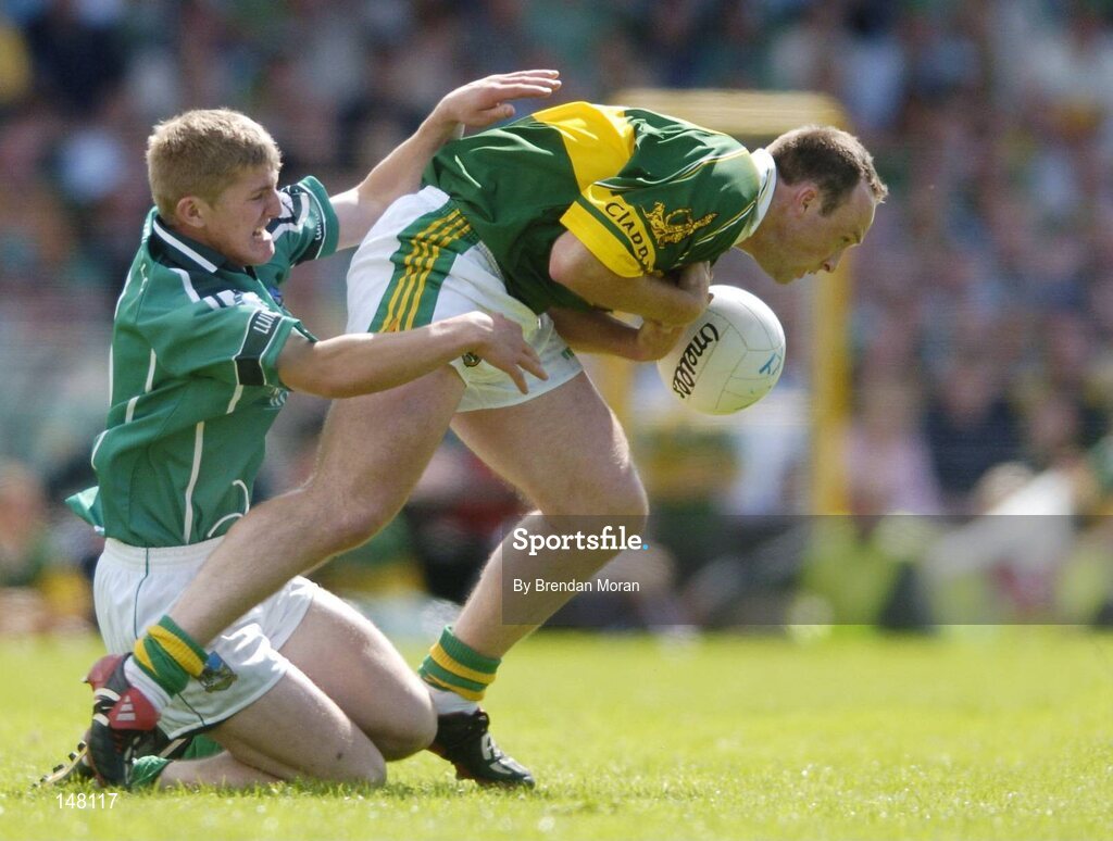 18 July 2004; John Crowley, Kerry, in action against Johnny McCarthy, Limerick. Bank of Ireland Munster Senior Football Championship Final Replay, Kerry v Limerick, Fitzgerald Stadium, Killarney, Co. Kerry. Picture credit; Brendan Moran / SPORTSFILE