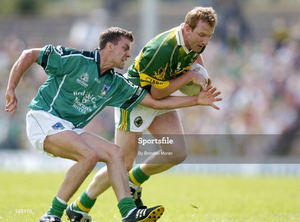 18 July 2004; Liam Hassett, Kerry, in action against Mike O'Brien, Limerick. Bank of Ireland Munster Senior Football Championship Final Replay, Kerry v Limerick, Fitzgerald Stadium, Killarney, Co. Kerry. Picture credit; Brendan Moran / SPORTSFILE