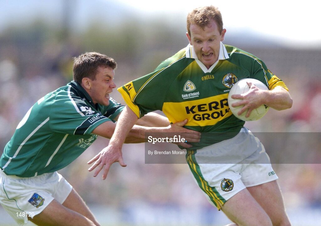 18 July 2004; Liam Hassett, Kerry, in action against Mike O'Brien, Limerick. Bank of Ireland Munster Senior Football Championship Final Replay, Kerry v Limerick, Fitzgerald Stadium, Killarney, Co. Kerry. Picture credit; Brendan Moran / SPORTSFILE