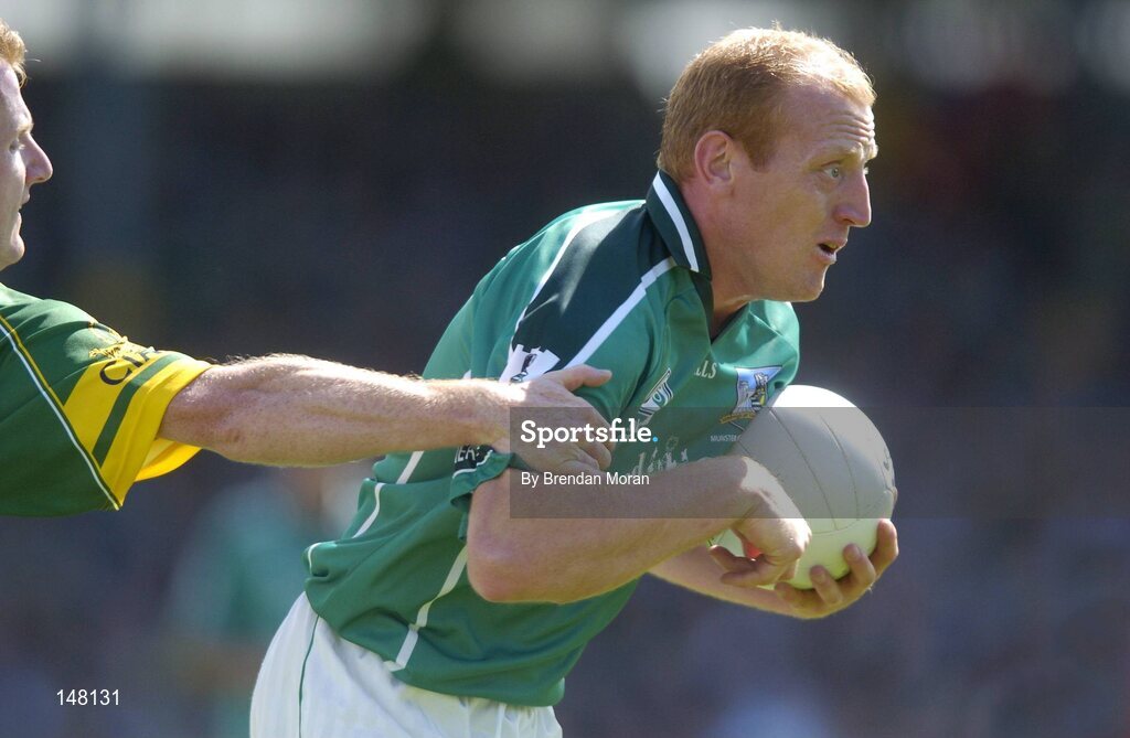 18 July 2004; John Quane, Limerick, in action against Liam Hassett, Kerry. Bank of Ireland Munster Senior Football Championship Final Replay, Kerry v Limerick, Fitzgerald Stadium, Killarney, Co. Kerry. Picture credit; Brendan Moran / SPORTSFILE