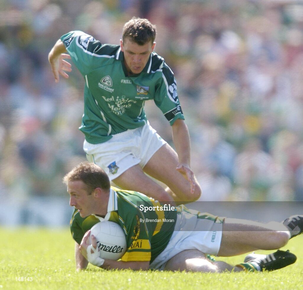 18 July 2004; Tommy Griffin, Kerry, in action against Mike O'Brien, Limerick. Bank of Ireland Munster Senior Football Championship Final Replay, Kerry v Limerick, Fitzgerald Stadium, Killarney, Co. Kerry. Picture credit; Brendan Moran / SPORTSFILE