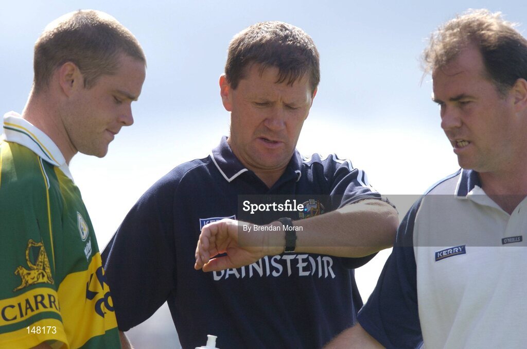 18 July 2004; Kerry manager Jack O'Connor checks his watch in the company of substitute Declan Quill, left, and fitness trainer Pat Flanagan. Bank of Ireland Munster Senior Football Championship Final Replay, Kerry v Limerick, Fitzgerald Stadium, Killarney, Co. Kerry. Picture credit; Brendan Moran / SPORTSFILE