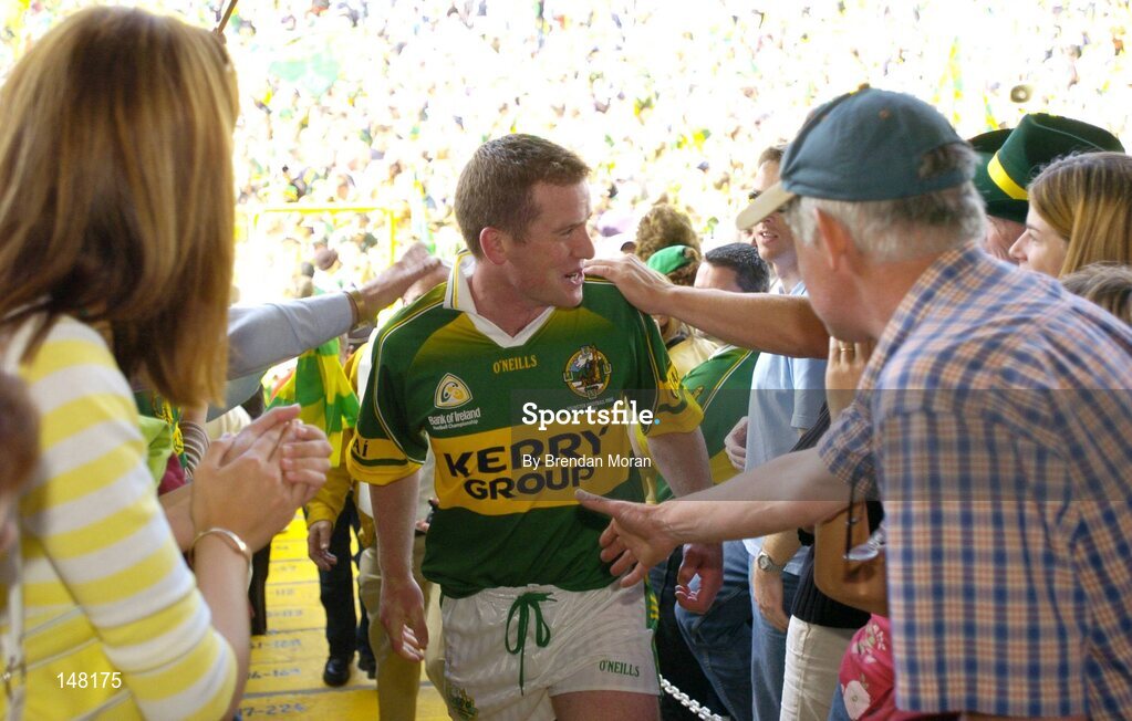 18 July 2004; Kerry captain Dara O'Cinneide is congratulated by fans as he makes his way to collect the cup. Bank of Ireland Munster Senior Football Championship Final Replay, Kerry v Limerick, Fitzgerald Stadium, Killarney, Co. Kerry. Picture credit; Brendan Moran / SPORTSFILE