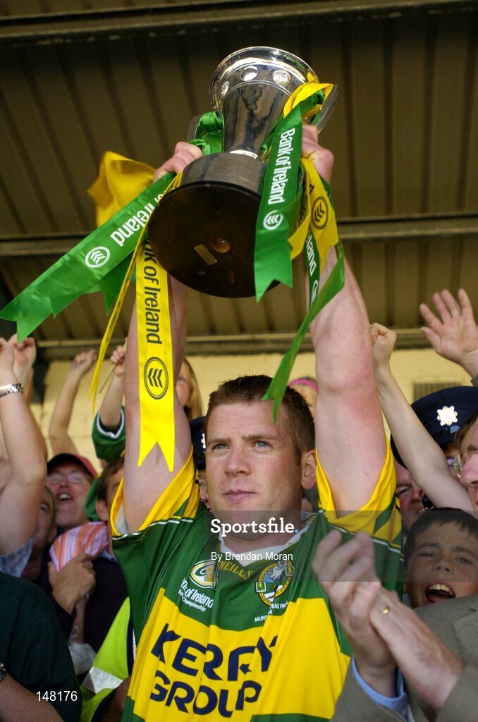 18 July 2004; Kerry captain Dara O'Cinneide lifts the Munster cup after victory over Limerick. Bank of Ireland Munster Senior Football Championship Final Replay, Kerry v Limerick, Fitzgerald Stadium, Killarney, Co. Kerry. Picture credit; Brendan Moran / SPORTSFILE