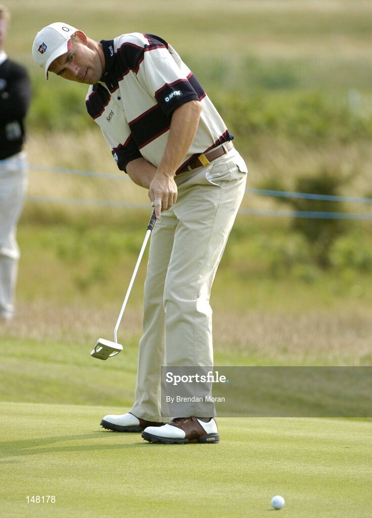 21 July 2004; Padraig Harrington watches his putt on the first green. Nissan Irish Open Pro Am, County Louth Golf Club, Baltray, Co. Louth. Picture credit; Brendan Moran / SPORTSFILE