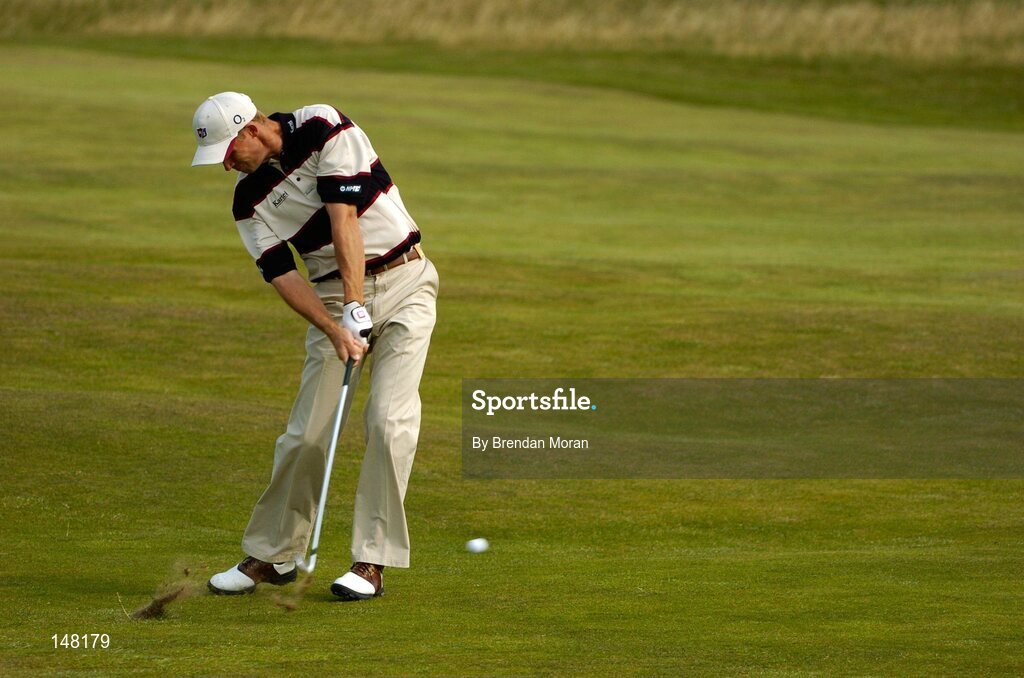 21 July 2004; Padraig Harrington plays his second shot on the 2nd fairway. Nissan Irish Open Pro Am, County Louth Golf Club, Baltray, Co. Louth. Picture credit; Brendan Moran / SPORTSFILE