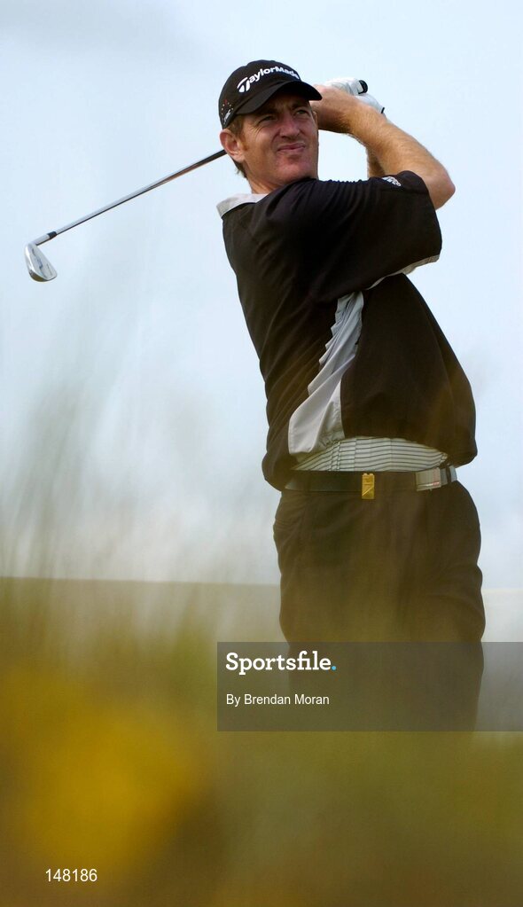 21 July 2004; Greg Owen watches his tee shot on the 8th tee box. Nissan Irish Open Pro Am, County Louth Golf Club, Baltray, Co. Louth. Picture credit; Brendan Moran / SPORTSFILE