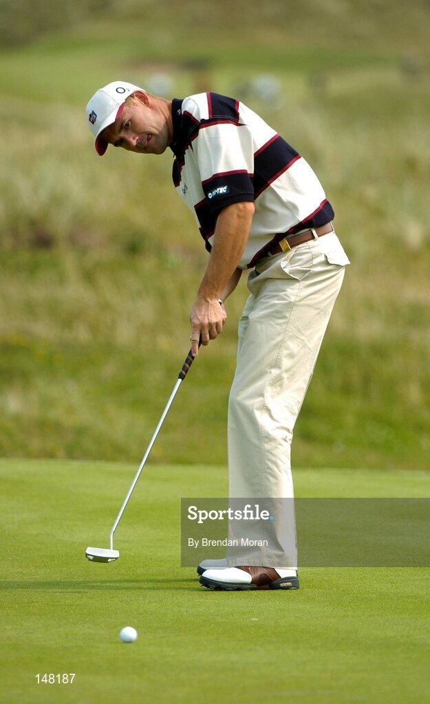 21 July 2004; Padraig Harrngton watches his putt on the 7th green. Nissan Irish Open Pro Am, County Louth Golf Club, Baltray, Co. Louth. Picture credit; Brendan Moran / SPORTSFILE