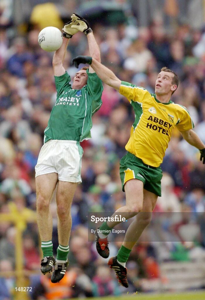 24 July 2004; Martin McGrath, Fermanagh, goes up for a high ball with Brendan Boyle, Donegal. Bank of Ireland Senior Football Championship Qualifier, Round 4, Fermanagh v Donegal, Tighernach's Park, Clones. Co. Monaghan. Picture credit; Damien Eagers / SPORTSFILE