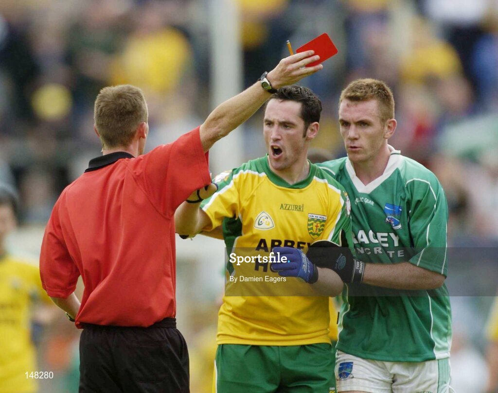 24 July 2004; Referee Joe McQuillan issues the red card to Donegal's Brendan Devenney, as Fermanagh's Martin McGrath attempts to restrain Devenney. Bank of Ireland Senior Football Championship Qualifier, Round 4, Fermanagh v Donegal, Tighernach's Park, Clones. Co. Monaghan. Picture credit; Damien Eagers / SPORTSFILE