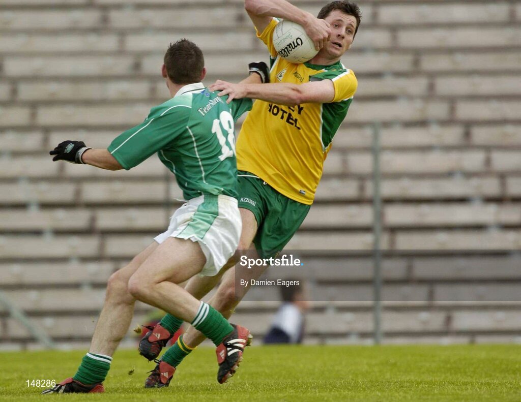 24 July 2004; Christy Toye, Donegal, in action against Damien Kelly, Fermanagh. Bank of Ireland Senior Football Championship Qualifier, Round 4, Fermanagh v Donegal, Tighernach's Park, Clones. Co. Monaghan. Picture credit; Damien Eagers / SPORTSFILE