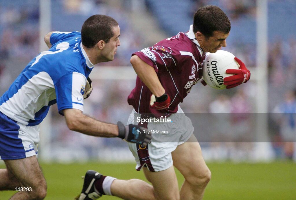 24 July 2004; Dessie Dolan, Westmeath, is tackled by Aidan Fennelly, Laois. Bank of Ireland Leinster Senior Football Championship Final Replay, Westmeath v Laois, Croke Park, Dublin. Picture credit; Ray McManus / SPORTSFILE