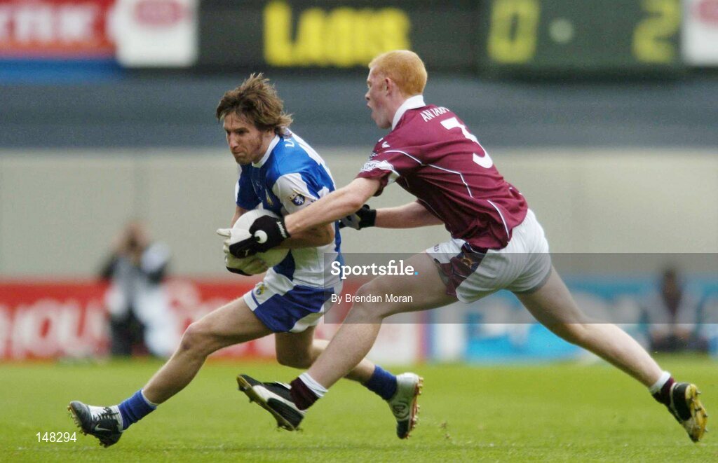 24 July 2004; Colm Parkinson, Laois, in action against Donal O'Donoghue, Westmeath. Bank of Ireland Leinster Senior Football Championship Final Replay, Westmeath v Laois, Croke Park, Dublin. Picture credit; Brendan Moran / SPORTSFILE