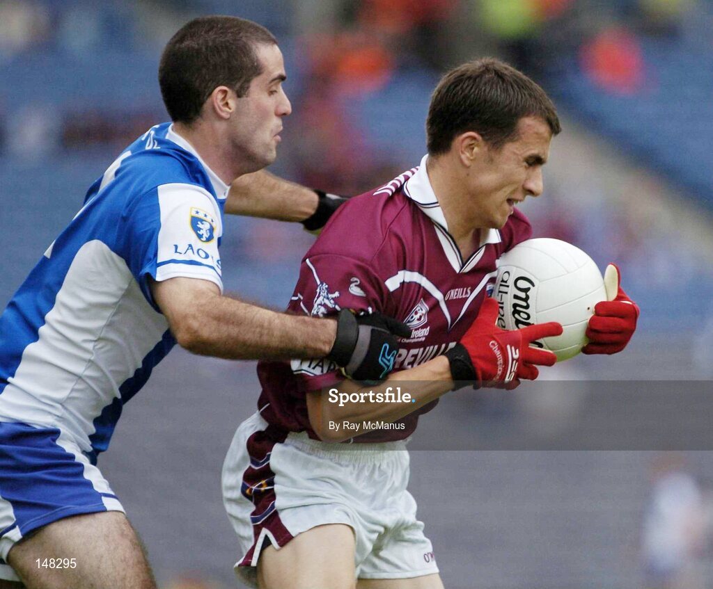 24 July 2004; Dessie Dolan, Westmeath, is tackled by Aidan Fennelly, Laois. Bank of Ireland Leinster Senior Football Championship Final Replay, Westmeath v Laois, Croke Park, Dublin. Picture credit; Ray McManus / SPORTSFILE