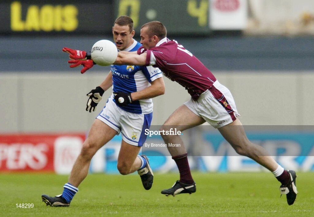 24 July 2004; Darren Rooney, Laois, in action against Paul Conway, Westmeath. Bank of Ireland Leinster Senior Football Championship Final Replay, Westmeath v Laois, Croke Park, Dublin. Picture credit; Brendan Moran / SPORTSFILE