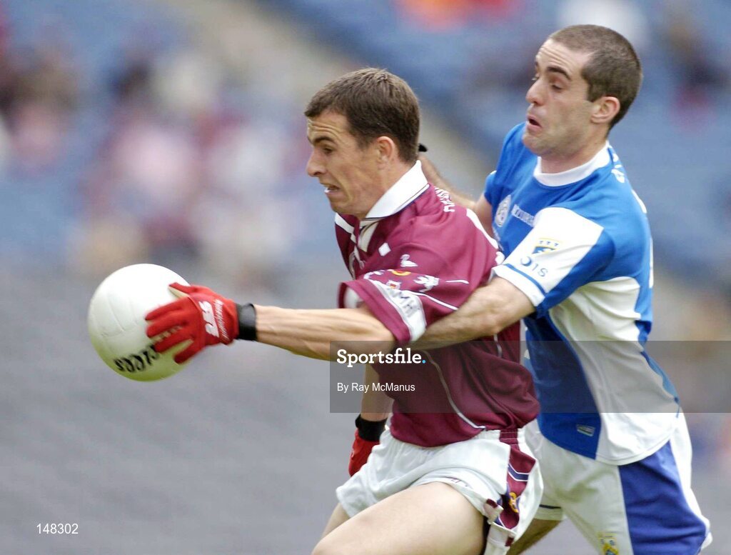 24 July 2004; Dessie Dolan, Westmeath, is tackled by Aidan Fennelly, Laois. Bank of Ireland Leinster Senior Football Championship Final Replay, Westmeath v Laois, Croke Park, Dublin. Picture credit; Ray McManus / SPORTSFILE