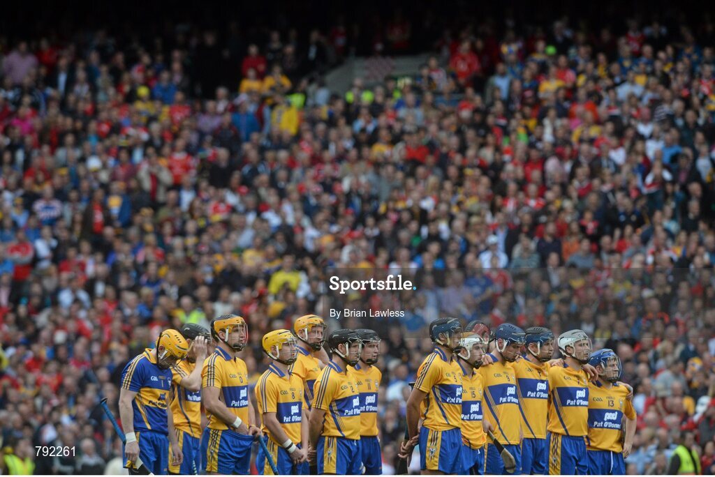 8 September 2013; Clare players stand for the national anthem. GAA Hurling All-Ireland Senior Championship Final, Cork v Clare, Croke Park, Dublin. Picture credit: Brian Lawless / SPORTSFILE