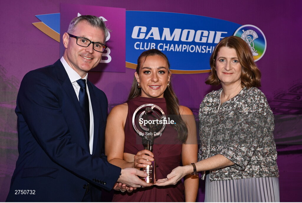 2 March 2024; Ciara Phelan of Dicksboro, Kilkenny, centre, is presented with her 2023 Team of the Year award by Uachtarán an Cumann Camógaíochta, Hilda Breslin and Chief Marketing Officer of AIB, Mark Doyle during the AIB Camogie Club Player Awards at Croke Park in Dublin. The awards recognise the top performing players throughout the AIB Camogie Club Championships and celebrate their hard work, commitment, and individual achievements from the 2023 season. Photo by Seb Daly/Sportsfile