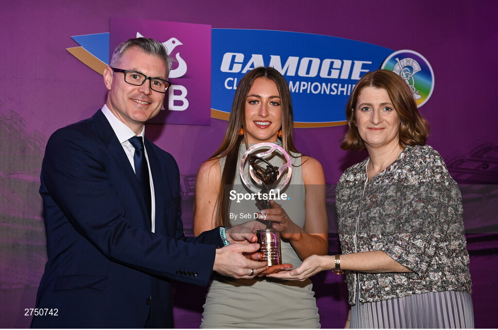2 March 2024; Aobha O’Gorman of Dicksboro, Kilkenny, centre, is presented with her 2023 Team of the Year award by Uachtarán an Cumann Camógaíochta, Hilda Breslin and Chief Marketing Officer of AIB, Mark Doyle during the AIB Camogie Club Player Awards at Croke Park in Dublin. The awards recognise the top performing players throughout the AIB Camogie Club Championships and celebrate their hard work, commitment, and individual achievements from the 2023 season. Photo by Seb Daly/Sportsfile