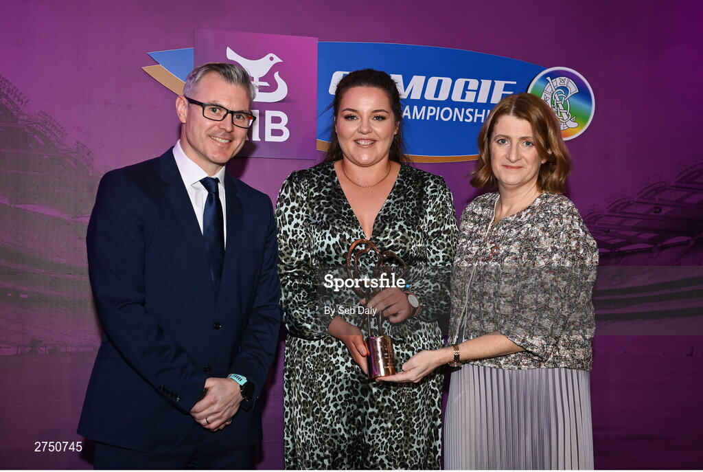2 March 2024; Kirsty Maher of Dicksboro, Kilkenny, centre, is presented with her 2023 Team of the Year award by Uachtarán an Cumann Camógaíochta, Hilda Breslin and Chief Marketing Officer of AIB, Mark Doyle during the AIB Camogie Club Player Awards at Croke Park in Dublin. The awards recognise the top performing players throughout the AIB Camogie Club Championships and celebrate their hard work, commitment, and individual achievements from the 2023 season. Photo by Seb Daly/Sportsfile