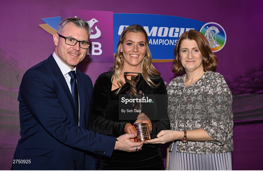 2 March 2024; Aoife Prendergast of Dicksboro, Kilkenny, is presented with her 2023 AIB Camogie Club Player of the Year award by Uachtarán an Cumann Camógaíochta, Hilda Breslin and Chief Marketing Officer of AIB, Mark Doyle during the AIB Camogie Club Player Awards at Croke Park in Dublin. The awards recognise the top performing players throughout the AIB Camogie Club Championships and celebrate their hard work, commitment, and individual achievements from the 2023 season. Photo by Seb Daly/Sportsfile
