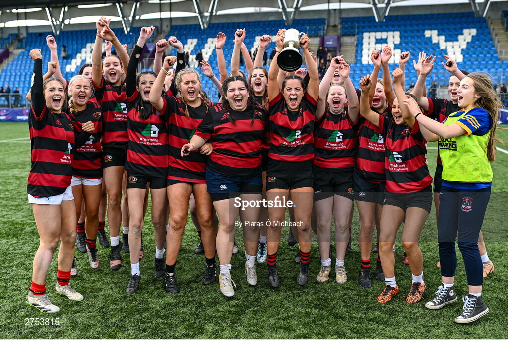 6 March 2024; St Mary's Arklow joint-captain Aoibhe Merrigan holds the cup aloft during the celebrations after her side's victory in the Bank of Ireland Leinster Rugby Schools Girls’ Junior final match between St Mary's New Ross and St Mary's Arklow at Energia Park in Dublin. Photo by Piaras Ó Mídheach/Sportsfile