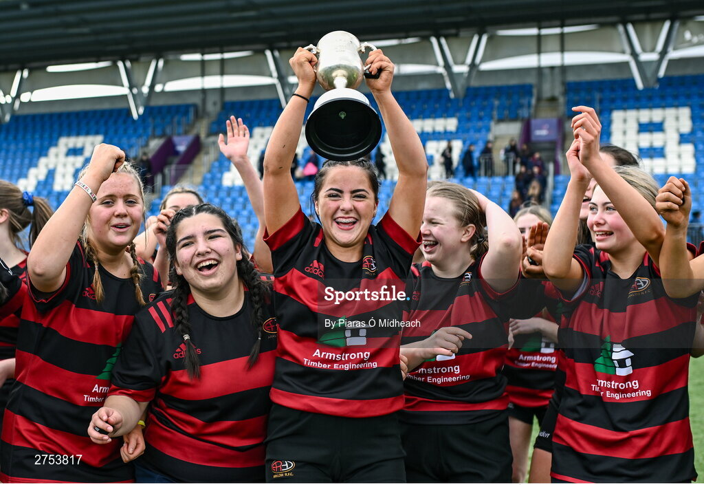 6 March 2024; St Mary's Arklow joint-captain Aoibhe Merrigan holds the cup aloft during the celebrations after her side's victory in the Bank of Ireland Leinster Rugby Schools Girls’ Junior final match between St Mary's New Ross and St Mary's Arklow at Energia Park in Dublin. Photo by Piaras Ó Mídheach/Sportsfile