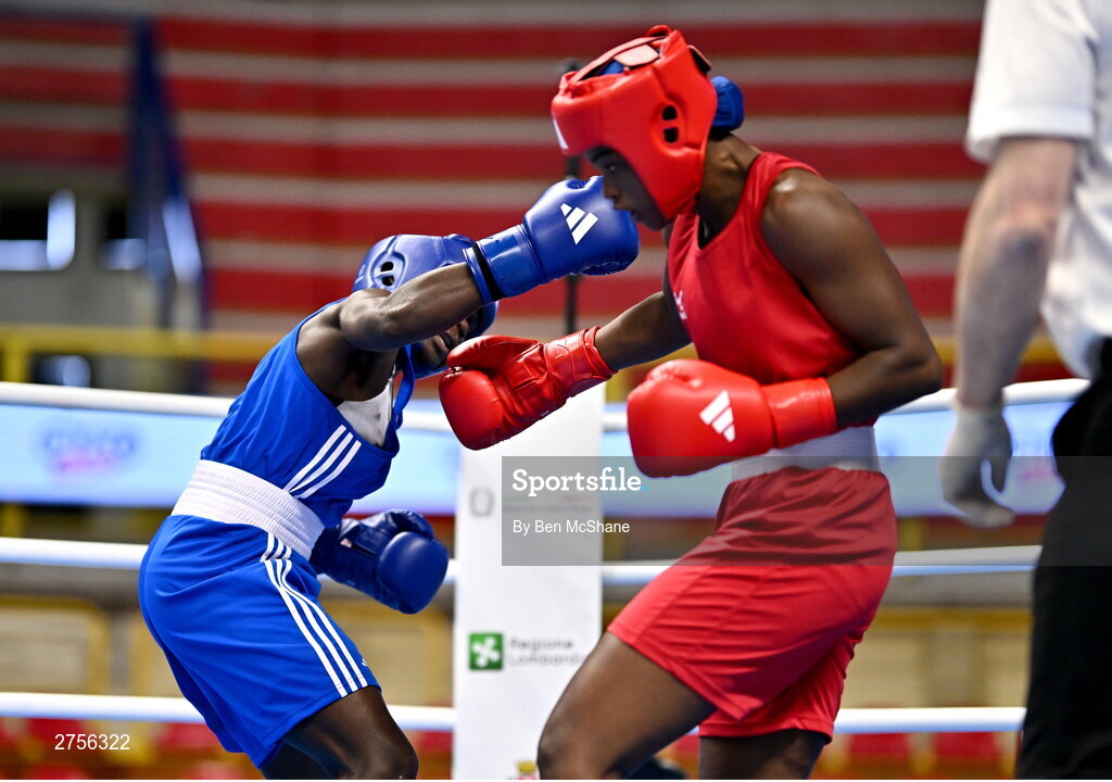 8 March 2024; Ivanusa Moreira of Cabo Verde, right, in action against Emily Tinah Nakalema of Uganda during their Women's 66kg Round of 32 bout during day six at the Paris 2024 Olympic Boxing Qualification Tournament at E-Work Arena in Busto Arsizio, Italy. Photo by Ben McShane/Sportsfile
