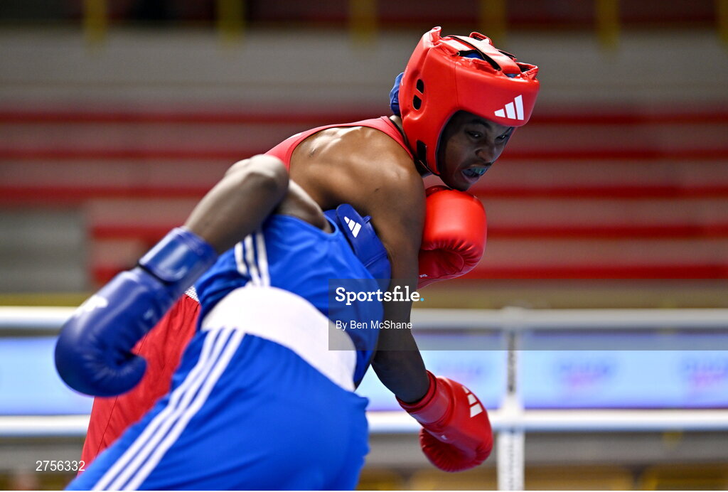 8 March 2024; Ivanusa Moreira of Cabo Verde, right, in action against Emily Tinah Nakalema of Uganda during their Women's 66kg Round of 32 bout during day six at the Paris 2024 Olympic Boxing Qualification Tournament at E-Work Arena in Busto Arsizio, Italy. Photo by Ben McShane/Sportsfile
