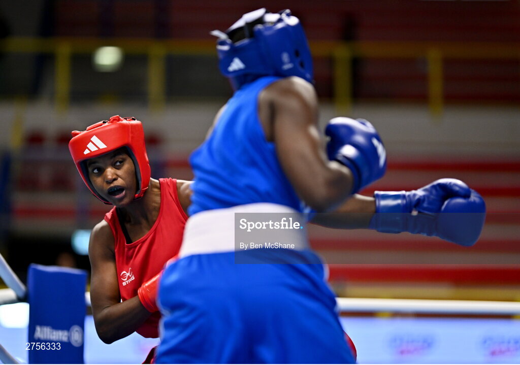 8 March 2024; Ivanusa Moreira of Cabo Verde, left, in action against Emily Tinah Nakalema of Uganda during their Women's 66kg Round of 32 bout during day six at the Paris 2024 Olympic Boxing Qualification Tournament at E-Work Arena in Busto Arsizio, Italy. Photo by Ben McShane/Sportsfile