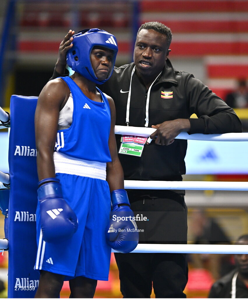 8 March 2024; Emily Tinah Nakalema of Uganda with Uganda coach Twaib Mayanja before their Women's 66kg Round of 32 bout against Ivanusa Moreira of Cabo Verde during day six at the Paris 2024 Olympic Boxing Qualification Tournament at E-Work Arena in Busto Arsizio, Italy. Photo by Ben McShane/Sportsfile