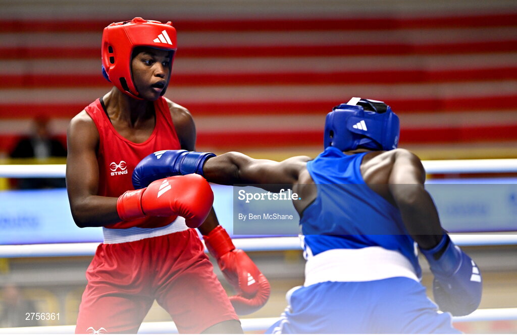 8 March 2024; Ivanusa Moreira of Cabo Verde, left, in action against Emily Tinah Nakalema of Uganda during their Women's 66kg Round of 32 bout during day six at the Paris 2024 Olympic Boxing Qualification Tournament at E-Work Arena in Busto Arsizio, Italy. Photo by Ben McShane/Sportsfile