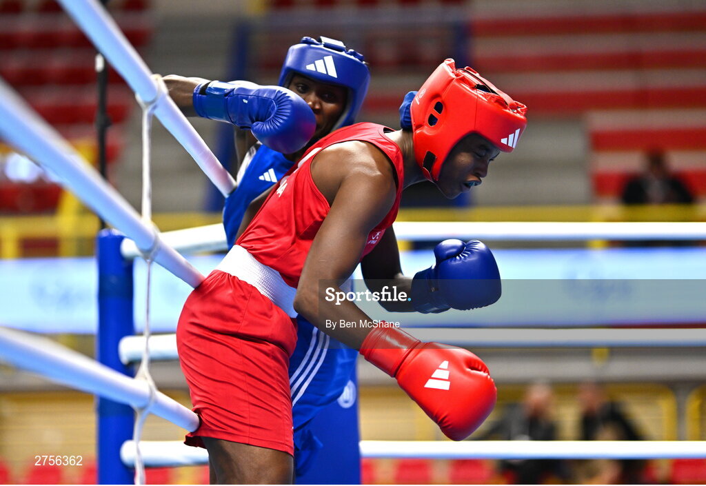 8 March 2024; Ivanusa Moreira of Cabo Verde, right, in action against Emily Tinah Nakalema of Uganda during their Women's 66kg Round of 32 bout during day six at the Paris 2024 Olympic Boxing Qualification Tournament at E-Work Arena in Busto Arsizio, Italy. Photo by Ben McShane/Sportsfile