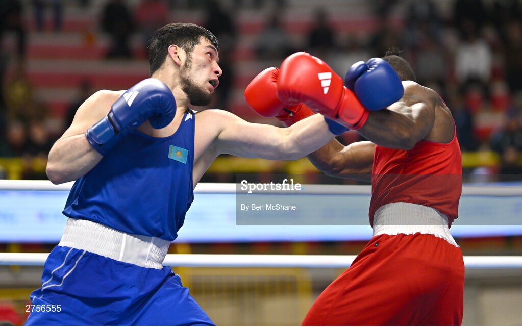 8 March 2024; Prewa Padabadi of Togo, right, in action against Nurbek Oralbay of Kazakhstan during their Men's 80kg Round of 32 bout during day six at the Paris 2024 Olympic Boxing Qualification Tournament at E-Work Arena in Busto Arsizio, Italy. Photo by Ben McShane/Sportsfile