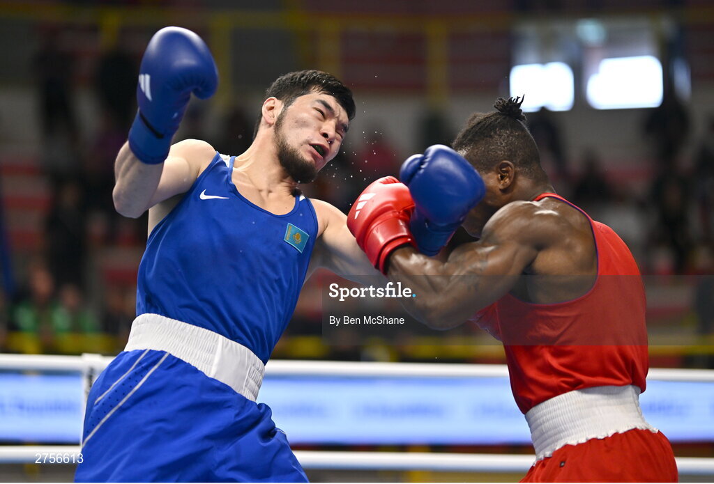 8 March 2024; Prewa Padabadi of Togo, right, in action against Nurbek Oralbay of Kazakhstan during their Men's 80kg Round of 32 bout during day six at the Paris 2024 Olympic Boxing Qualification Tournament at E-Work Arena in Busto Arsizio, Italy. Photo by Ben McShane/Sportsfile