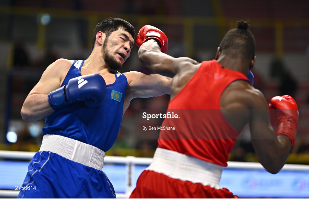 8 March 2024; Prewa Padabadi of Togo, right, in action against Nurbek Oralbay of Kazakhstan during their Men's 80kg Round of 32 bout during day six at the Paris 2024 Olympic Boxing Qualification Tournament at E-Work Arena in Busto Arsizio, Italy. Photo by Ben McShane/Sportsfile