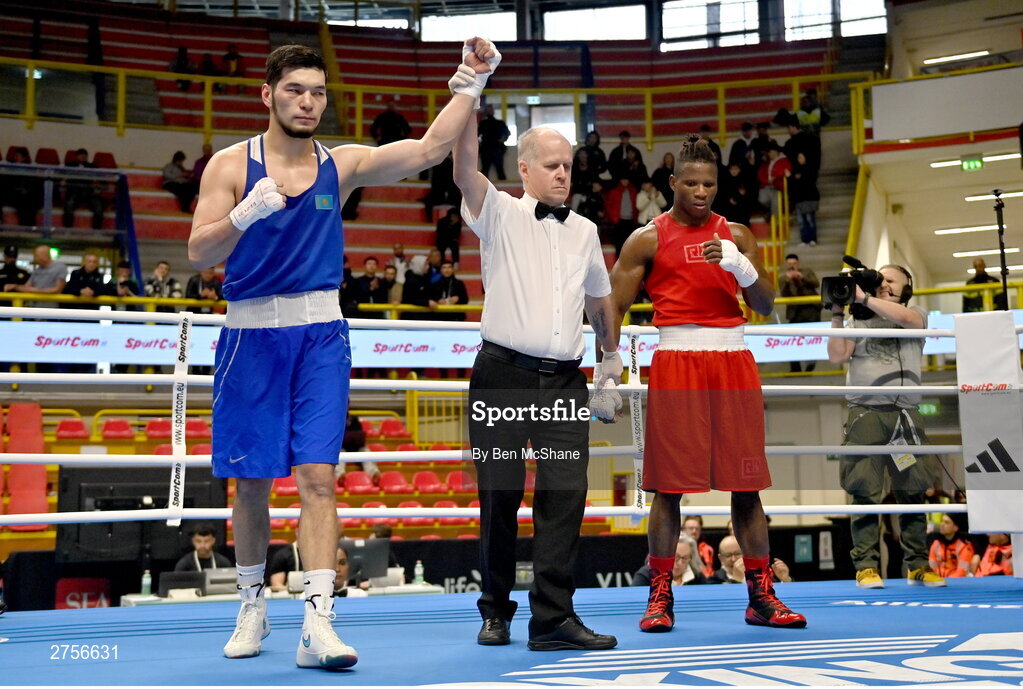 8 March 2024; Nurbek Oralbay of Kazakhstan is declared victorious in their Men's 80kg Round of 32 bout against Prewa Padabadi of Togo during day six at the Paris 2024 Olympic Boxing Qualification Tournament at E-Work Arena in Busto Arsizio, Italy. Photo by Ben McShane/Sportsfile