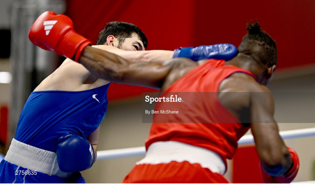 8 March 2024; Prewa Padabadi of Togo, right, in action against Nurbek Oralbay of Kazakhstan during their Men's 80kg Round of 32 bout during day six at the Paris 2024 Olympic Boxing Qualification Tournament at E-Work Arena in Busto Arsizio, Italy. Photo by Ben McShane/Sportsfile