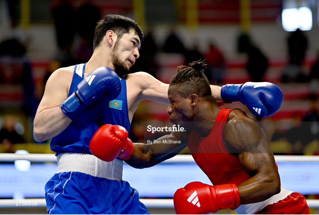 8 March 2024; Prewa Padabadi of Togo, right, in action against Nurbek Oralbay of Kazakhstan during their Men's 80kg Round of 32 bout during day six at the Paris 2024 Olympic Boxing Qualification Tournament at E-Work Arena in Busto Arsizio, Italy. Photo by Ben McShane/Sportsfile