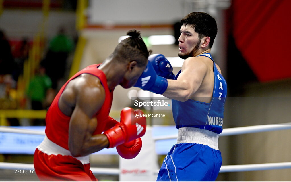 8 March 2024; Prewa Padabadi of Togo, left, in action against Nurbek Oralbay of Kazakhstan during their Men's 80kg Round of 32 bout during day six at the Paris 2024 Olympic Boxing Qualification Tournament at E-Work Arena in Busto Arsizio, Italy. Photo by Ben McShane/Sportsfile