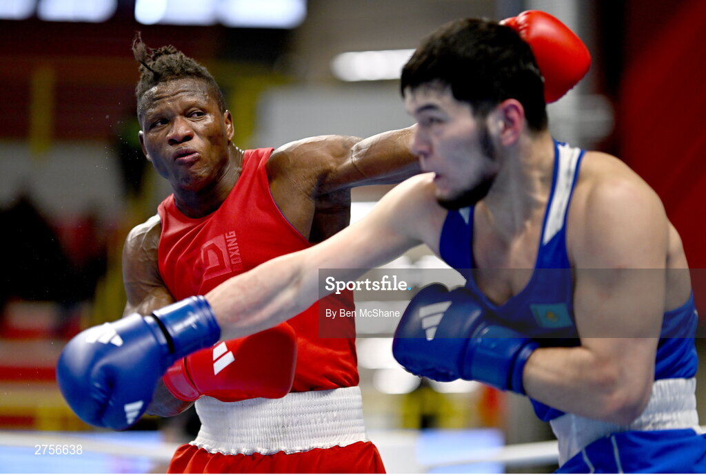8 March 2024; Prewa Padabadi of Togo, left, in action against Nurbek Oralbay of Kazakhstan during their Men's 80kg Round of 32 bout during day six at the Paris 2024 Olympic Boxing Qualification Tournament at E-Work Arena in Busto Arsizio, Italy. Photo by Ben McShane/Sportsfile
