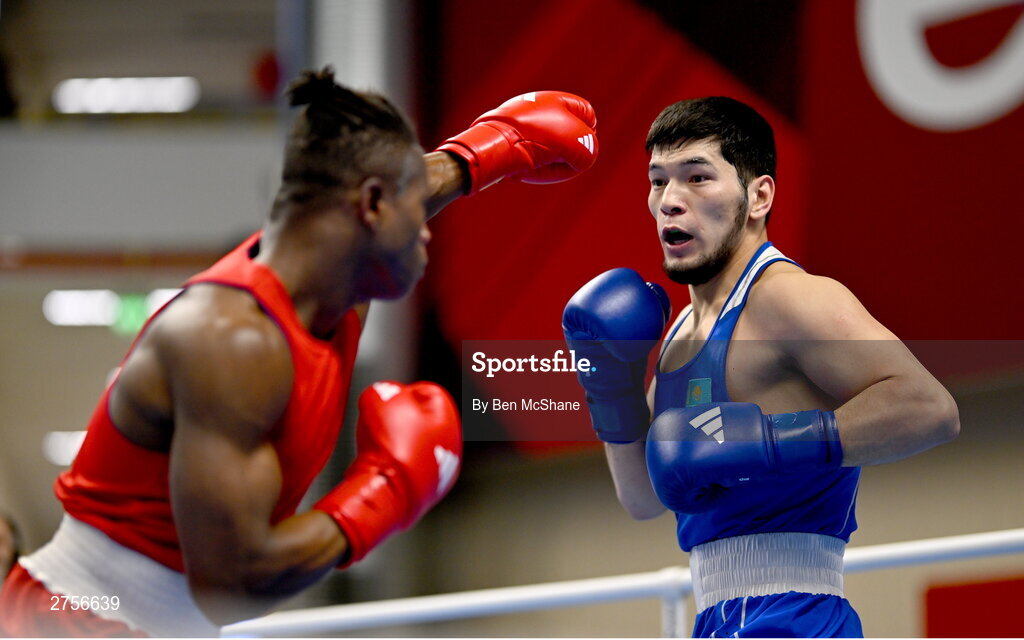 8 March 2024; Prewa Padabadi of Togo, left, in action against Nurbek Oralbay of Kazakhstan during their Men's 80kg Round of 32 bout during day six at the Paris 2024 Olympic Boxing Qualification Tournament at E-Work Arena in Busto Arsizio, Italy. Photo by Ben McShane/Sportsfile